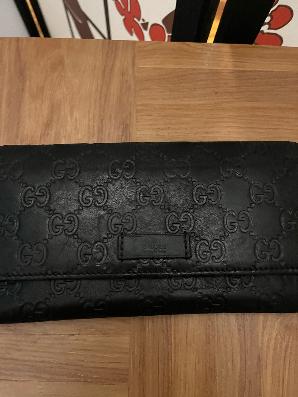 Gucci Black Embossed leather wallet with gold chain